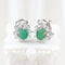 Boucles d'oreilles Boucles d'oreilles halo en or blanc 18 carats, émeraudes et diamants 58 Facettes 125977F