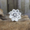 Bague 52 Bague rosette en or blanc 18 carats et diamants 58 Facettes 136043