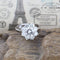 Bague 52 Bague rosette en or blanc 18 carats et diamants 58 Facettes 136043