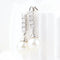 Boucles d'oreilles Boucles d'oreilles en or blanc 18 carats avec diamants et perles 58 Facettes