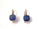 Boucles d'oreilles Pomellato Nudo - Boucles d'oreilles en or blanc et saphirs bleus 58 Facettes