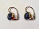 Boucles d'oreilles Pomellato Nudo - Boucles d'oreilles en or blanc et saphirs bleus 58 Facettes