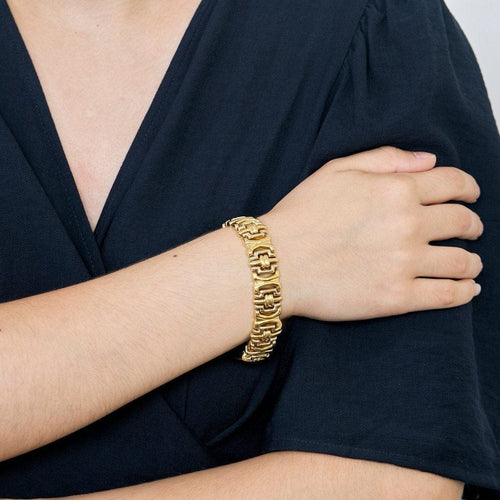 Bracelet Bracelet souple articulé à maillons godronnés en or jaune et or gris 18k 58 Facettes PL07