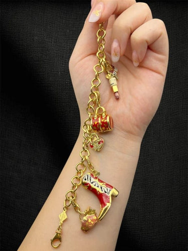 Bracelet Pretty Woman - Bracelet à breloques en or jaune 58 Facettes