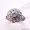Bague 56 Bague marguerite Art déco en or 18 carats et platine, diamants 58 Facettes 4072