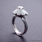 Bague 56 Bague marguerite Art déco en or 18 carats et platine, diamants 58 Facettes 4072