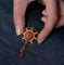 Broche Broche pompon en or jaune 18K au cabochon de corail 58 Facettes