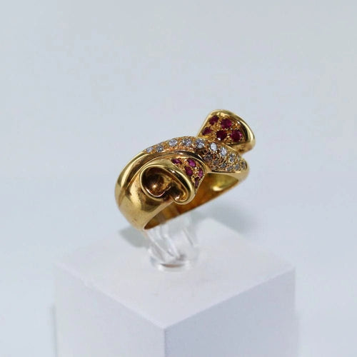 Bague 56 Bague croisée nœud en or jaune, diamants et rubis 58 Facettes