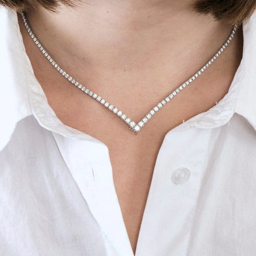 Collier Collier tennis rivière en chute en or blanc 18k et diamants 58 Facettes
