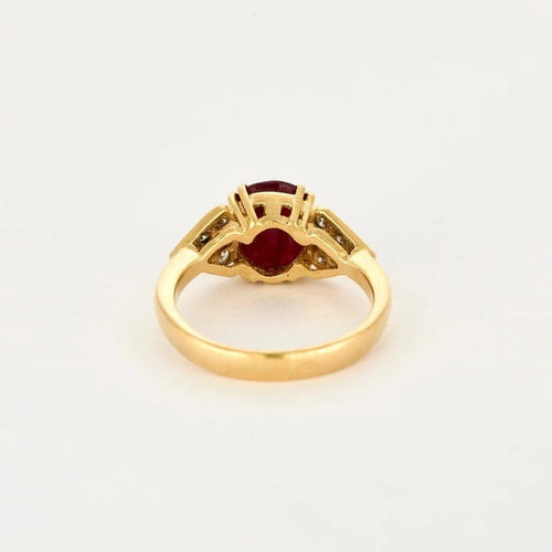 Bague 55 Bague en or jaune 18K sertie d’un rubis et diamants 58 Facettes