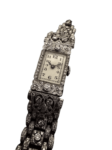 Montre Montre Art déco rectangulaire en platine et or blanc sertie de diamants 58 Facettes