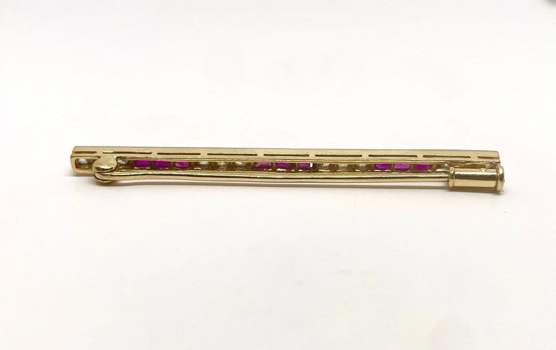 Broche Broche en or jaune et or gris, rubis et diamants 58 Facettes