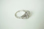 Bague 48 Bague marguerite en or blanc 18 k et diamants 58 Facettes SQ8512637