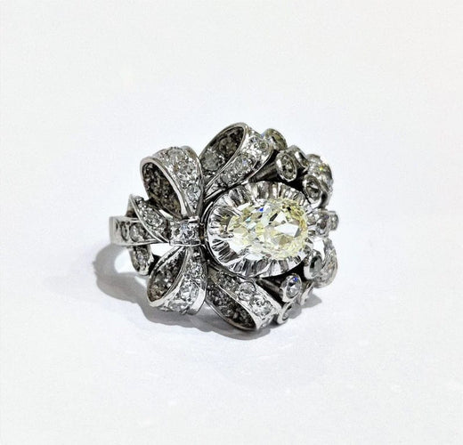 Bague 55 Bague années 50 à motif de nœuds en platine 850 et diamants 58 Facettes 1-775/2