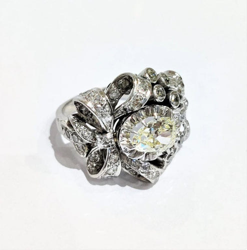 Bague 55 Bague années 50 à motif de nœuds en platine 850 et diamants 58 Facettes 1-775/2