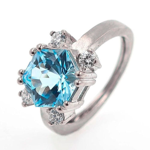 Bague Bague design en or blanc 18 carats avec topaze bleue et diamants 58 Facettes AO-0003