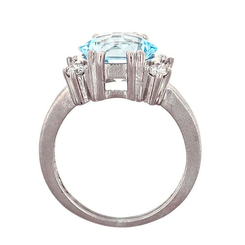 Bague Bague design en or blanc 18 carats avec topaze bleue et diamants 58 Facettes AO-0003