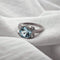 Bague Bague design en or blanc 18 carats avec topaze bleue et diamants 58 Facettes AO-0003