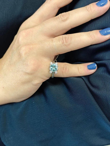 Bague Bague design en or blanc 18 carats avec topaze bleue et diamants 58 Facettes AO-0003
