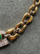 Collier Collier ras-de-cou en or jaune et blanc avec émeraude et diamants 58 Facettes