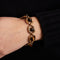 Bracelet Boucheron - Bracelet vintage en or jaune et œil de tigre 58 Facettes