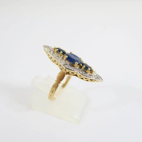 Bague 54 Bague marquise en or jaune et or blanc 18 carats, saphirs et diamants 58 Facettes