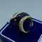 Bague 57 Bague en or jaune 14 kt, diamants et onyx 58 Facettes