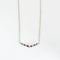 Collier Collier en or blanc 18 carats avec rubis, émeraudes et diamants 58 Facettes 1056180