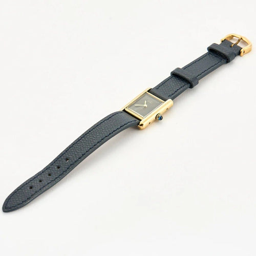 Montre Cartier Tank Must - Montre en argent 925 plaqué or, cadran noir laqué 58 Facettes