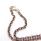 Collier Collier croix - Pendentif en or blanc, argent et topazes bleues 58 Facettes D363906SO
