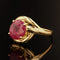 Bague 57 Bague tourbillon en or jaune 18 carats avec rubis ovale 58 Facettes 22-249