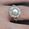 Bague 55 Bague marguerite ancienne perle fine et diamants en or rose 58 Facettes 19-642