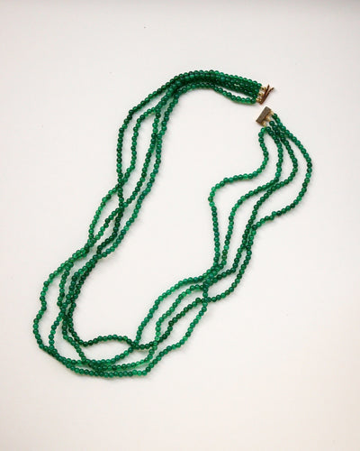 Collier Collier quatre rangs de perles d’émeraude en or jaune 18 ct 58 Facettes A11960