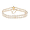 https://cdn.shopify.com/s/files/1/0647/1470/3075/files/Bracelet_de_Luxe_-_Bracelet_de_Perles_2_Rangs_Or_Jaune_-_Joaillerie_Paris_-_Les_Pierres_de_Julie_1.jpg?v=1771945034