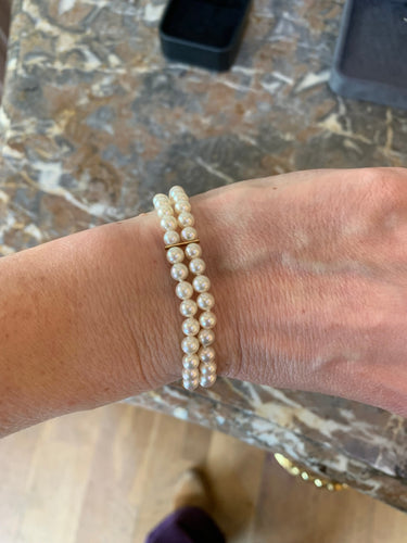 https://cdn.shopify.com/s/files/1/0647/1470/3075/files/Bracelet_de_Luxe_-_Bracelet_de_Perles_2_Rangs_Or_Jaune_-_Joaillerie_Paris_-_Les_Pierres_de_Julie_3.jpg?v=1771945034