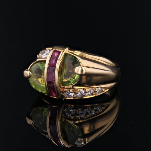 https://www.bijouxbaume.com/upload/image/bague-chevaliere-peridot-diamants-et-rubis-p-image-162751-grande.jpg
