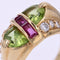 https://www.bijouxbaume.com/upload/image/bague-chevaliere-peridot-diamants-et-rubis-p-image-162749-grande.jpg