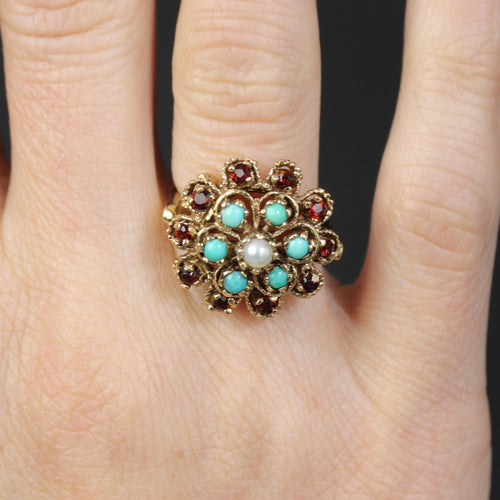 https://www.bijouxbaume.com/upload/image/bague-fleur-or-jaune-grenats-turquoise-perle-p-image-154919-grande.jpg