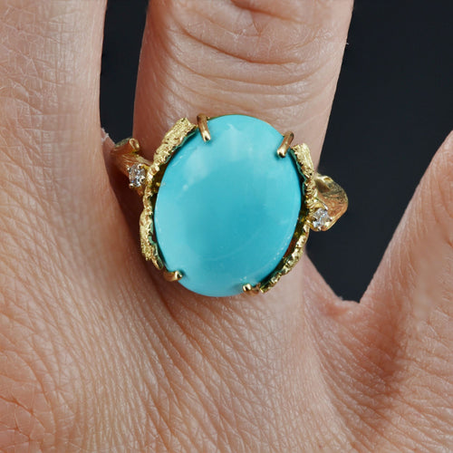 https://www.bijouxbaume.com/upload/image/bague-turquoise-diamants-monture-feuillagee-p-image-122555-grande.jpg