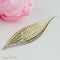Pendentif Brosche feuille en or jaune 18 carats et diamants 7,50 ct 58 Facettes 1702