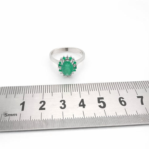 Bague 54 Bague marguerite en or blanc 18 carats, émeraudes et diamants 58 Facettes Bague marguerite en or émeraudes et diamants