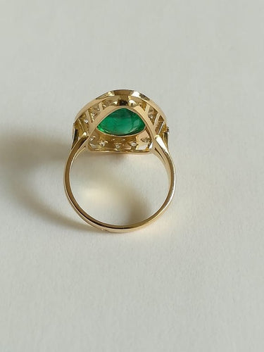 Bague 54 Bague marquise en or jaune, émeraude et diamants 58 Facettes 01347