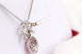 Collier Collier avec pendentif-broche nœud pavé de diamants et rubis 58 Facettes MT240099