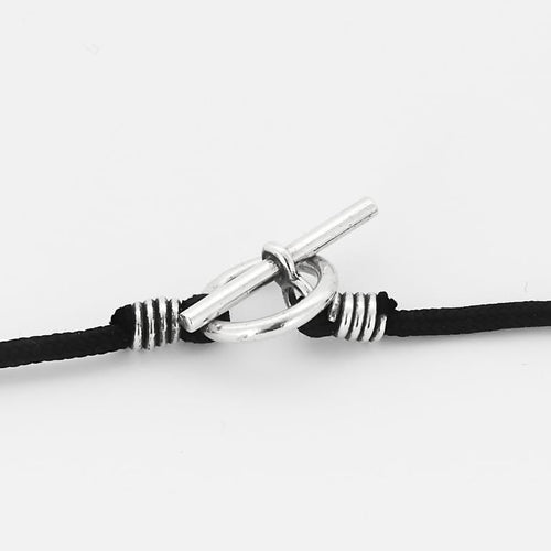 Pendentif Hermès - Chaîne d'ancre - Pendentif rond en argent et cordelière en coton noir 58 Facettes 58FC38