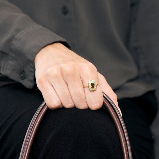 Bague 54 Bague marguerite en or jaune 18K grenat et diamants 58 Facettes PAL32243