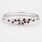 Bracelet Bracelet jonc ouvrant rubis et diamants en or blanc 750 58 Facettes LP1345/
