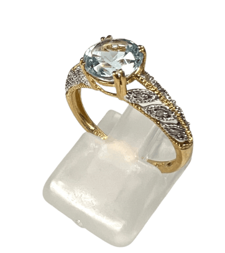 Bague 55 Bague ajourée en or jaune et or blanc 18 carats, topaze et diamants 58 Facettes 279