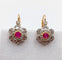 Boucles d'oreilles Dormeuses marguerite antiques en or rose 18k, platine, rubis synthétiques et diamants 58 Facettes A06712