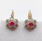 Boucles d'oreilles Dormeuses marguerite antiques en or rose 18k, platine, rubis synthétiques et diamants 58 Facettes A06712
