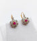 Boucles d'oreilles Dormeuses marguerite antiques en or rose 18k, platine, rubis synthétiques et diamants 58 Facettes A06712